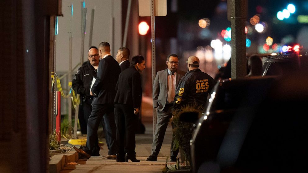 PHOTO: Investigators gather at a scene where a shooting took place in Monterey Park, Calif., Sunday, Jan. 22, 2023.