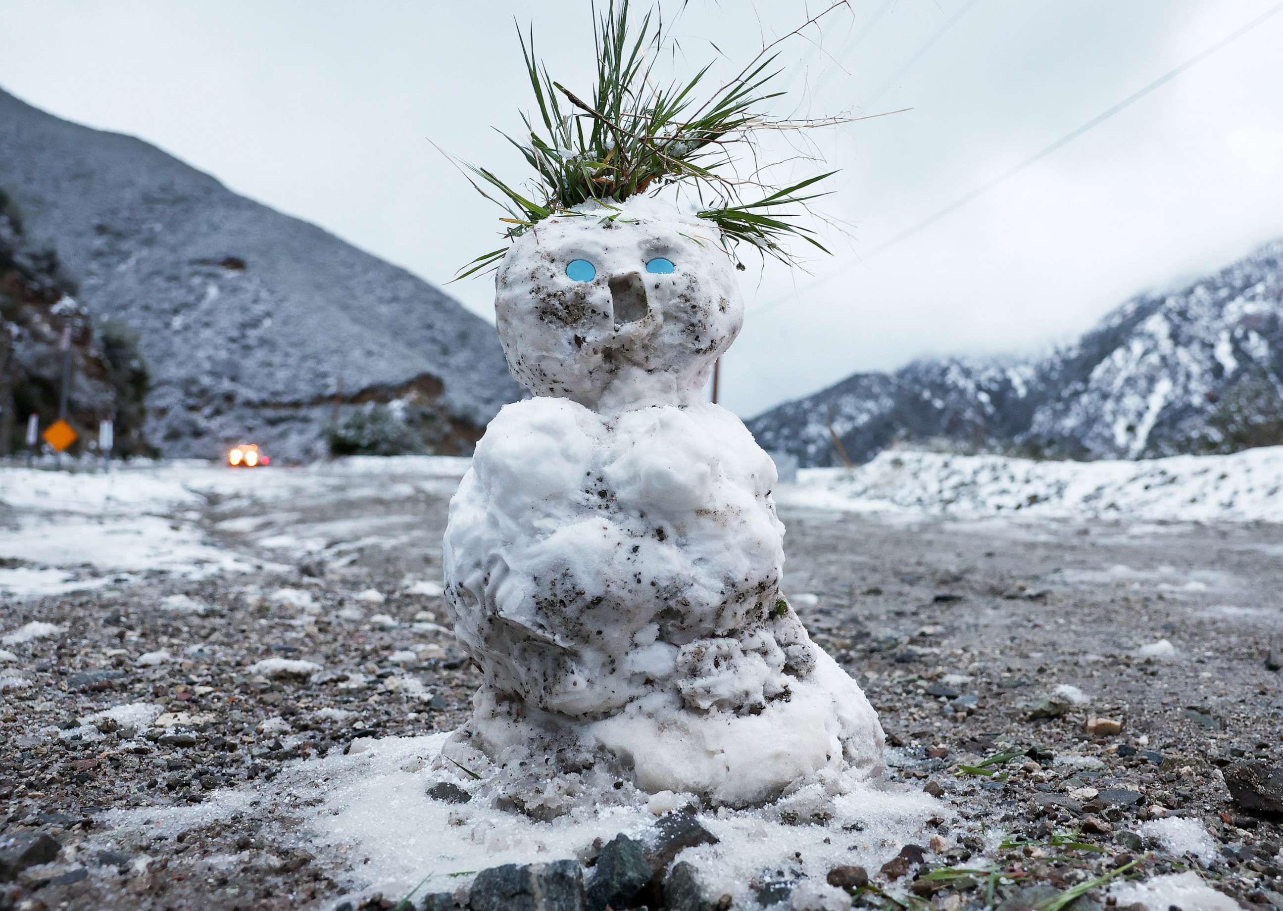 PHOTO: A snowman stands as snow blankets the Angeles National Forest in Los Angeles County on February 23, 2023 near Claremont, California.