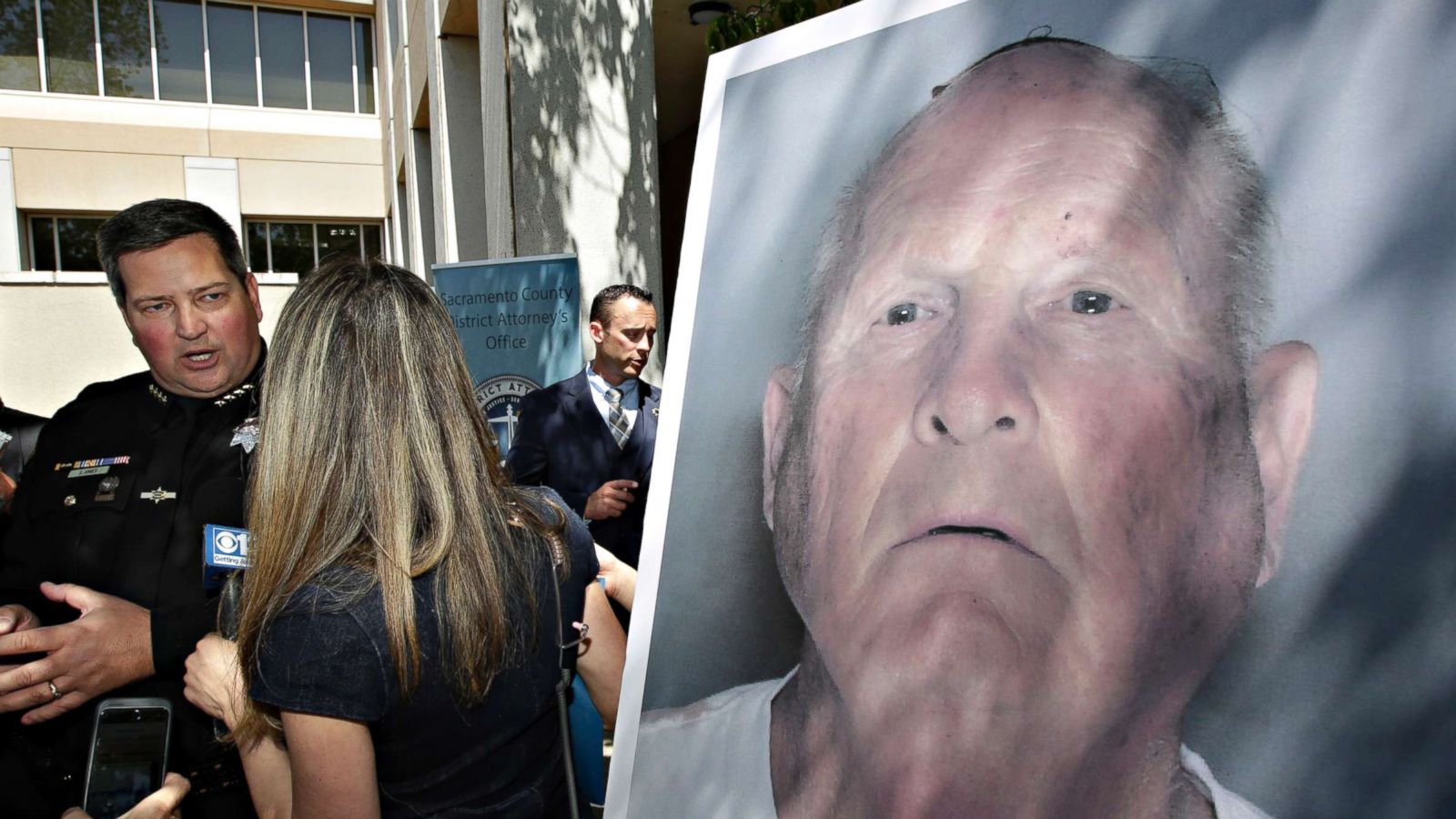 Sacramento County Sheriff Scott Jones talks to reporters about the arrest Joesph James DeAngelo, right, on suspicion of committing a string of violent crimes in the 1970's and 1980's after a news conference, April 25, 2018, in Sacramento, Calif.