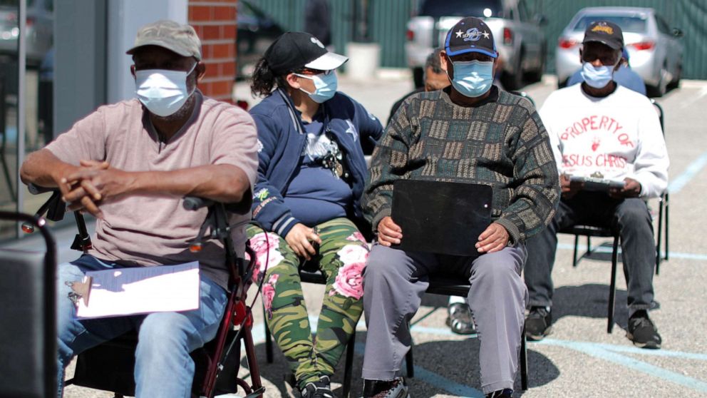 PHOTO: People wait to receive a second coronavirus disease (COVID-19) vaccination in Los Angeles, March 12, 2021.
