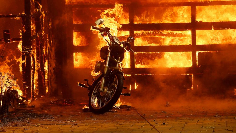 PHOTO: A motorcycle burns in the driveway of a home on fire in Glen Ellen, Calif., Oct. 9, 2017. 
