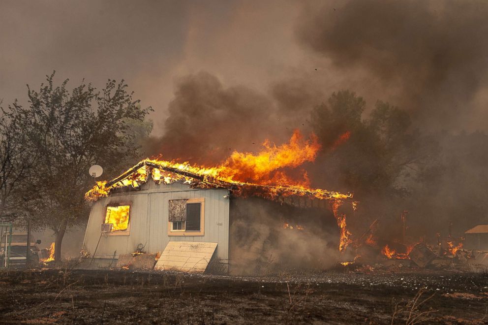 PHOTO: A Spring Valley house is consumed by flames as the Ranch Fire continued to expand westward in Lake County, Calif.