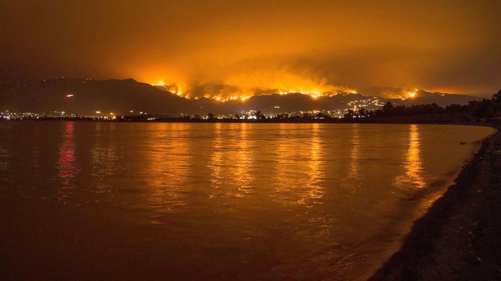 PHOTO: Flames from the Holy Fire are reflected in Lake Elsinore as the wildfire burns in the Cleveland National Forest, in Lake Elsinore, Calif., Aug. 8, 2018.