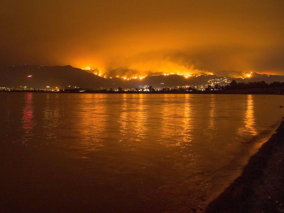 PHOTO: Flames from the Holy Fire are reflected in Lake Elsinore as the wildfire burns in the Cleveland National Forest, in Lake Elsinore, Calif., Aug. 8, 2018.