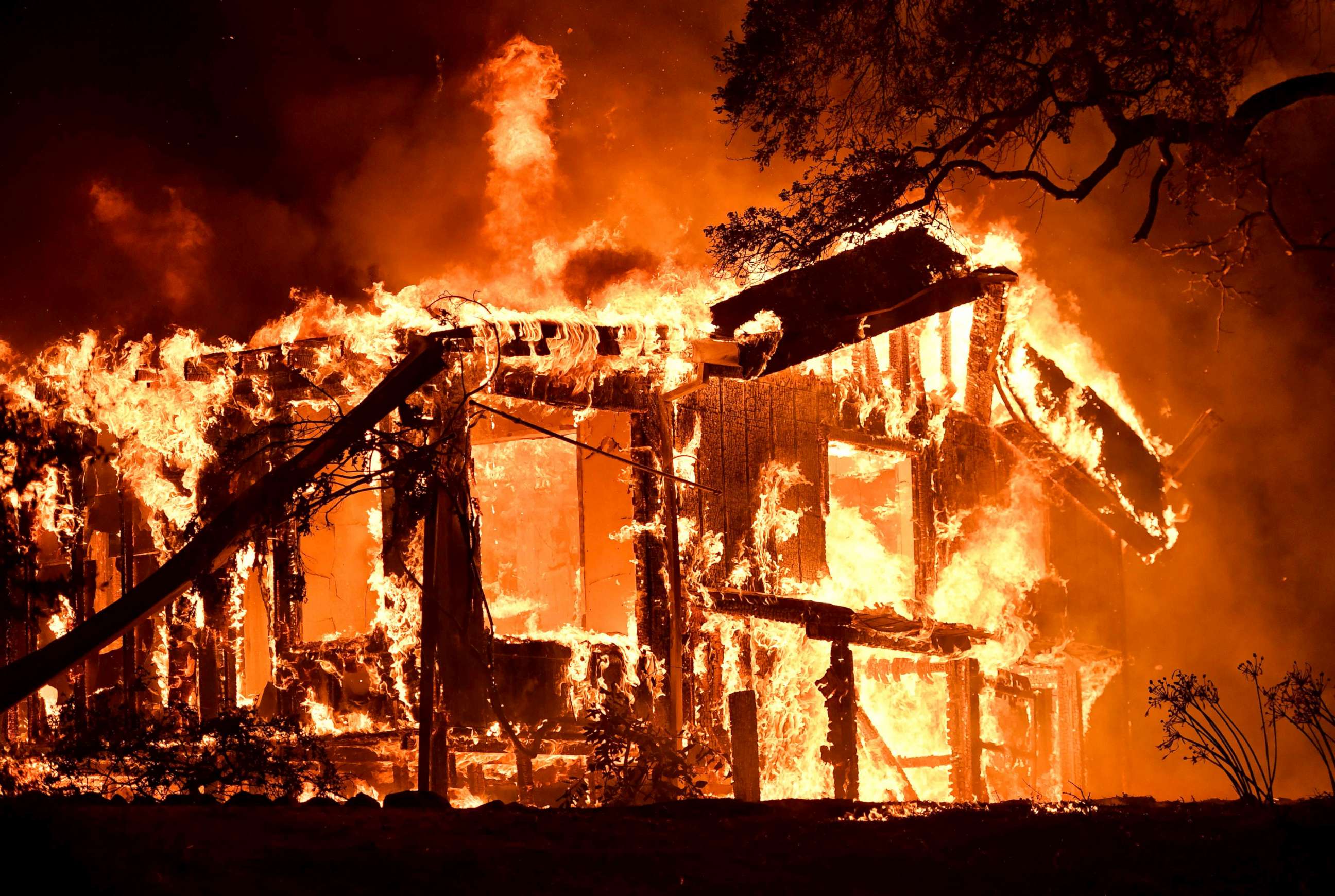 PHOTO: Flames ravage a home in the Napa wine region in California, Oct. 9, 2017, as multiple wind-driven fires continue to whip through the region.