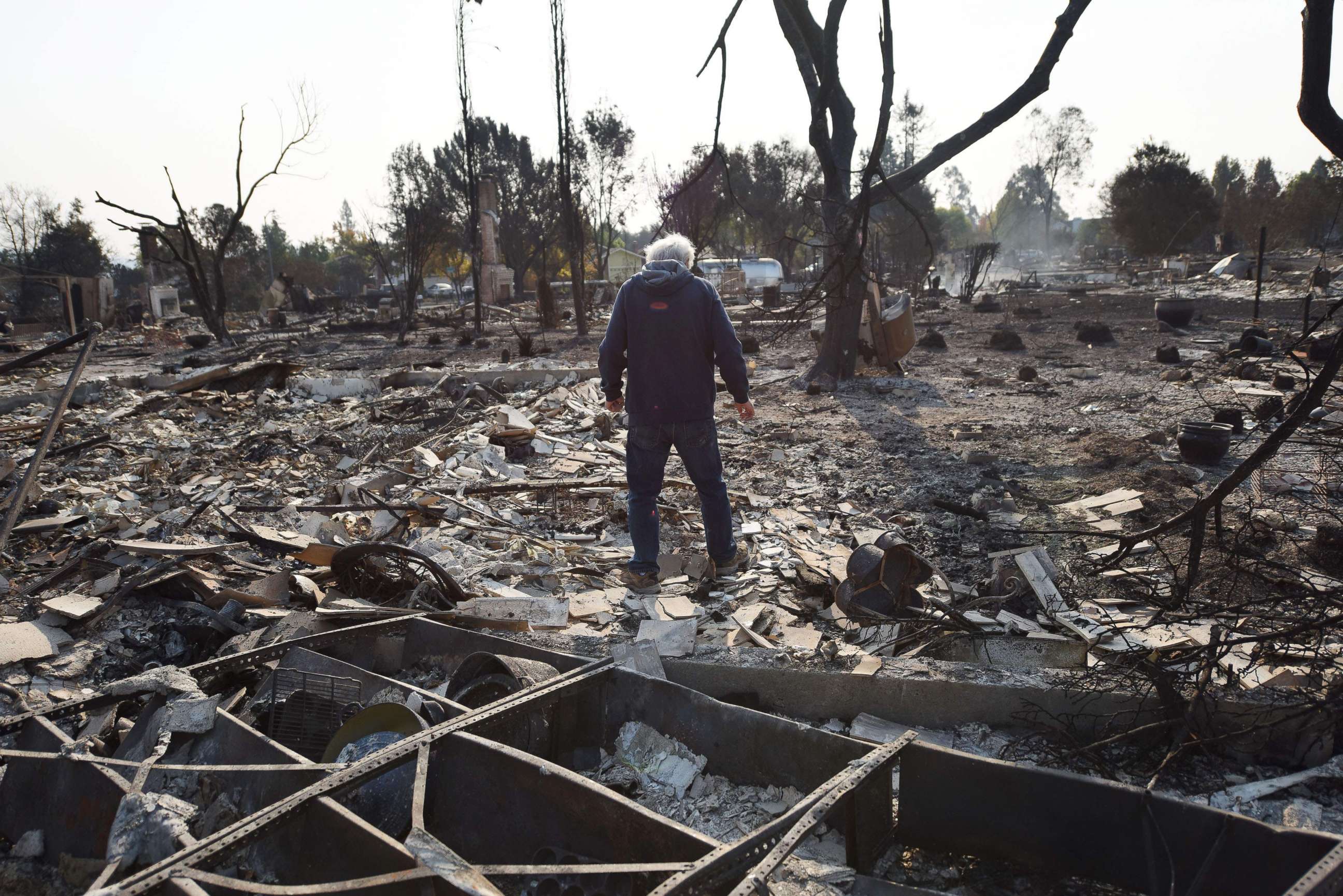 PHOTO: Homeowner Phil Rush looks at the remains of his home destroyed by wildfire in Santa Rosa, Calif., Oct. 11, 2017.  
