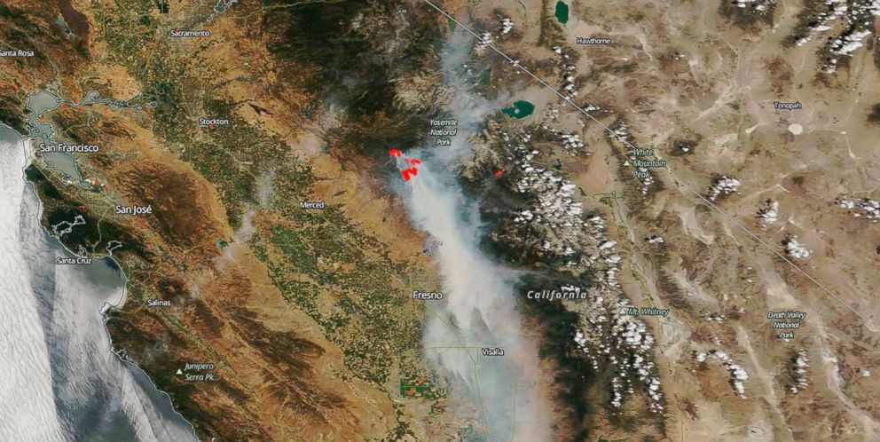 PHOTO: This image captured by NASA's Terra satellite on July 25, 2018, shows actively burning California wildfires (outlined in red) detected by thermal bands.