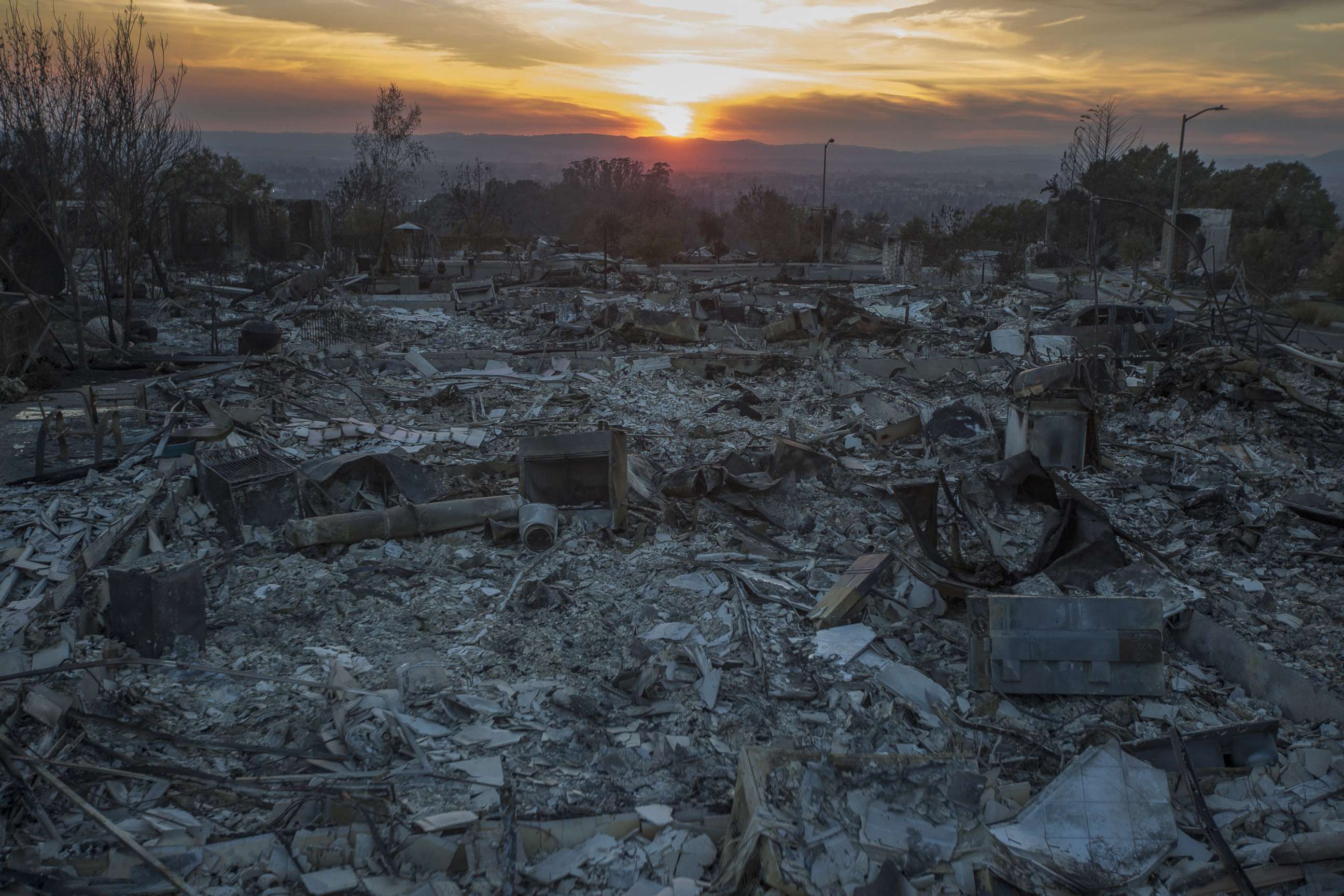 PHOTO: The ruins of houses destroyed by the Tubbs Fire are seen near Fountaingrove Parkway, Oct. 14, 2017 in Santa Rosa, Calif.