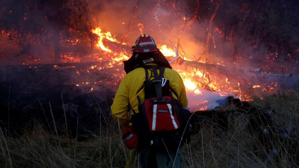 Firefighters battle a wildfire near Santa Rosa, Calif., Oct. 14, 2017.