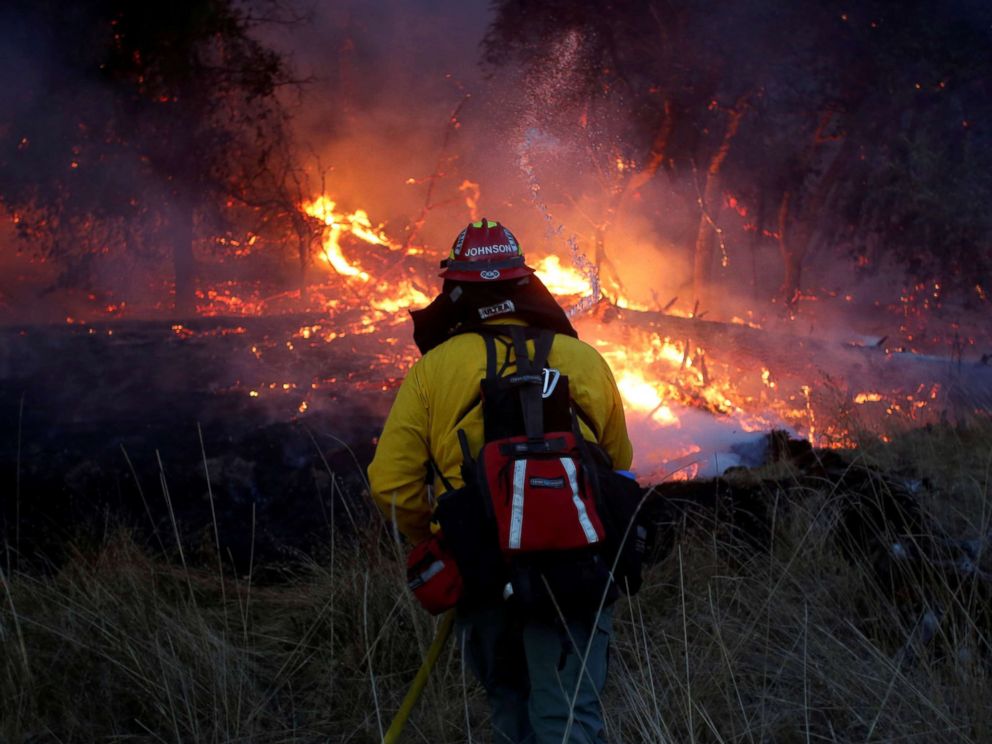PHOTO: Firefighters battle a wildfire near Santa Rosa, Calif., Oct. 14, 2017.