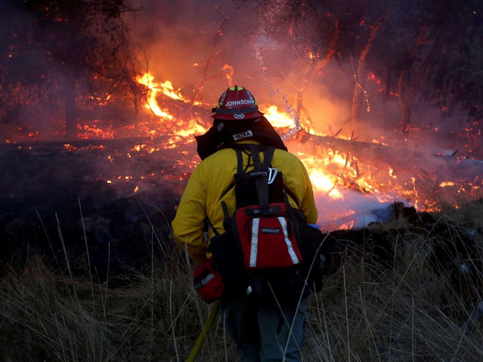 PHOTO: Firefighters battle a wildfire near Santa Rosa, Calif., Oct. 14, 2017. 
