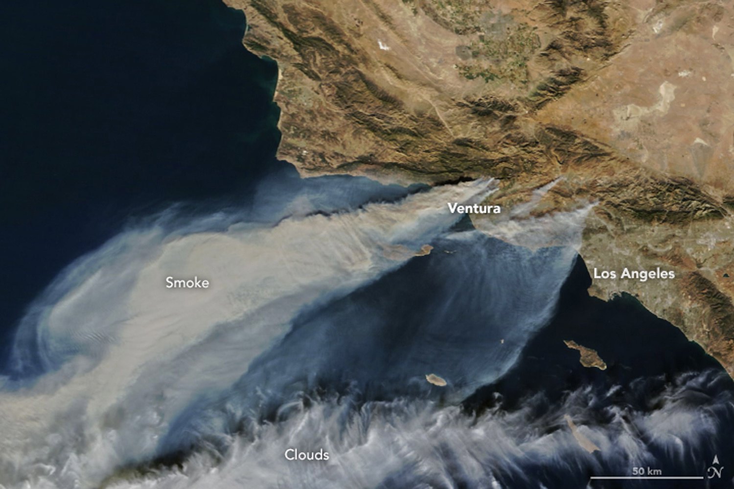 PHOTO: A handout photo made available by NASA Earth Observatory showing thick smoke streaming from several fires in southern California, when the Moderate Resolution Imaging Spectroradiometer (MODIS) captured this natural-color image Dec. 5, 2017.