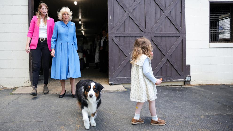 PHOTO: Smitten Farm manager Hunter Marek with daughter Violet Marek walk with Queen Camilla at Smitten Farm on the final day of the state visit of King Charles III and Queen Camilla, April 30, 2026 in The Plains, Virginia. 