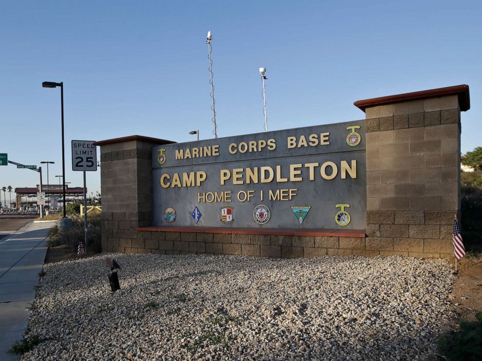 PHOTO: Vehicles file through the main gate of Camp Pendleton Marine Base, Nov. 13, 2013, at Camp Pendleton, Calif.