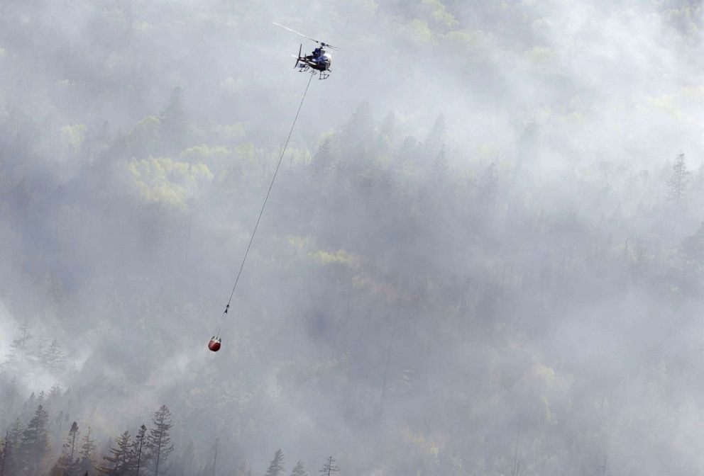 PHOTO: A helicopter drops water on the Tantallon wildfire, west of Halifax, Canada, May 29, 2023.