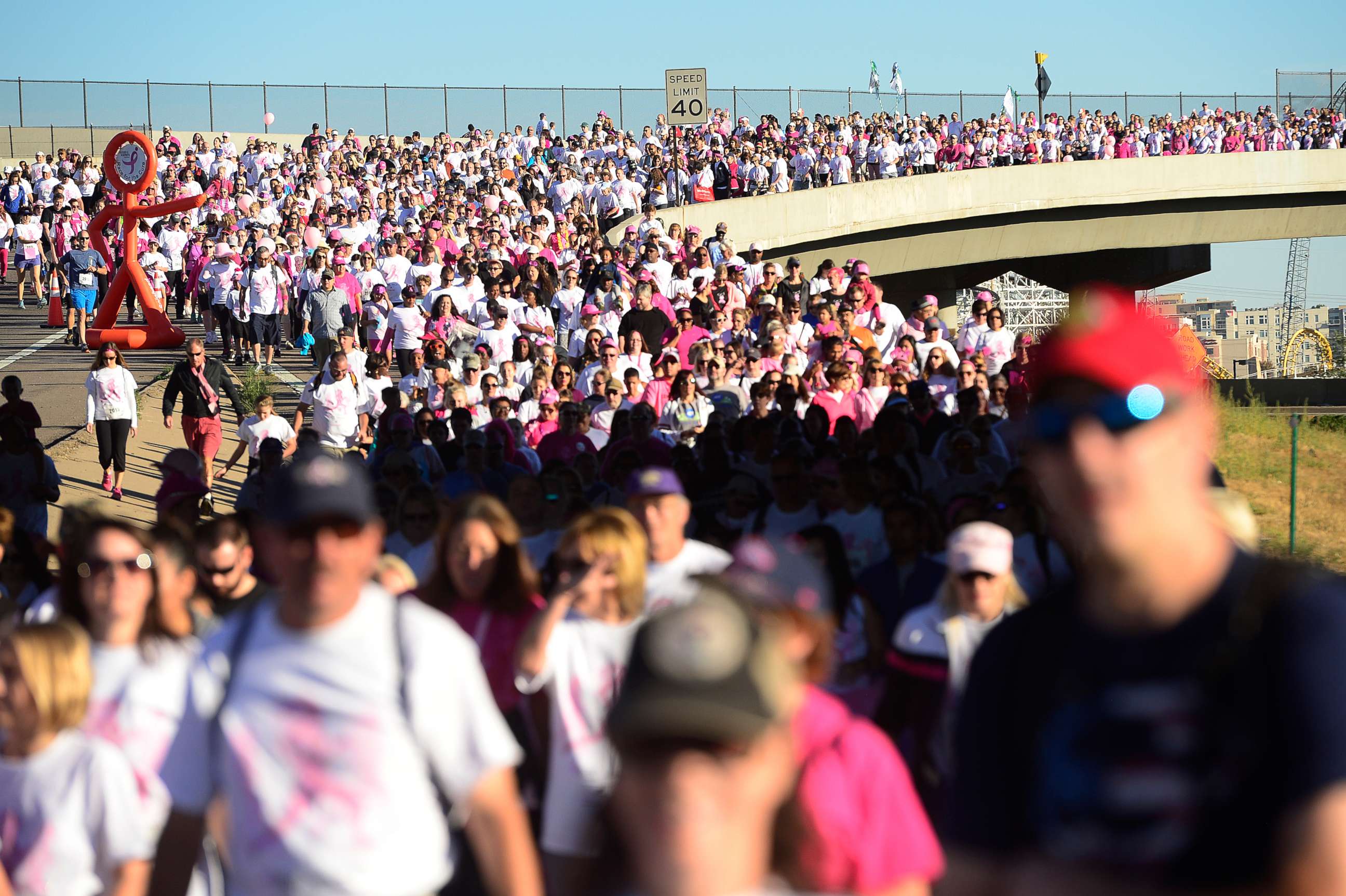 PHOTO: Thousands of walkers and runner make their way along the route for the Susan G. Koman Race for the Cure, Sept. 27, 2015, along Auraria Parkway in Denver, Colo.