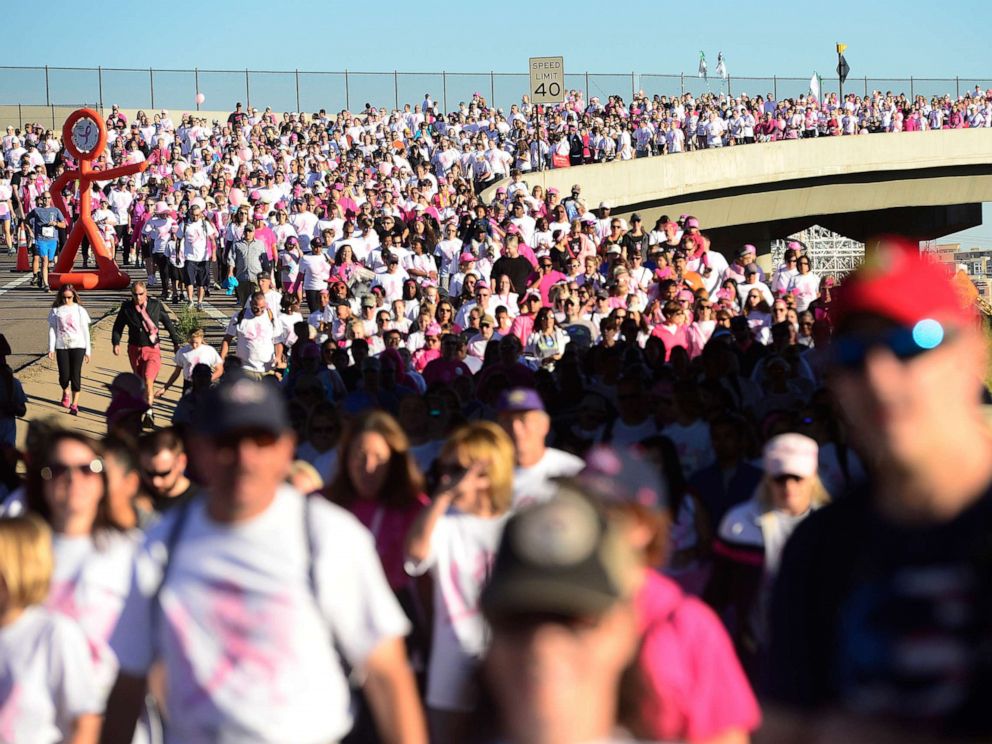 PHOTO: Thousands of walkers and runner make their way along the route for the Susan G. Koman Race for the Cure, Sept. 27, 2015, along Auraria Parkway in Denver, Colo.
