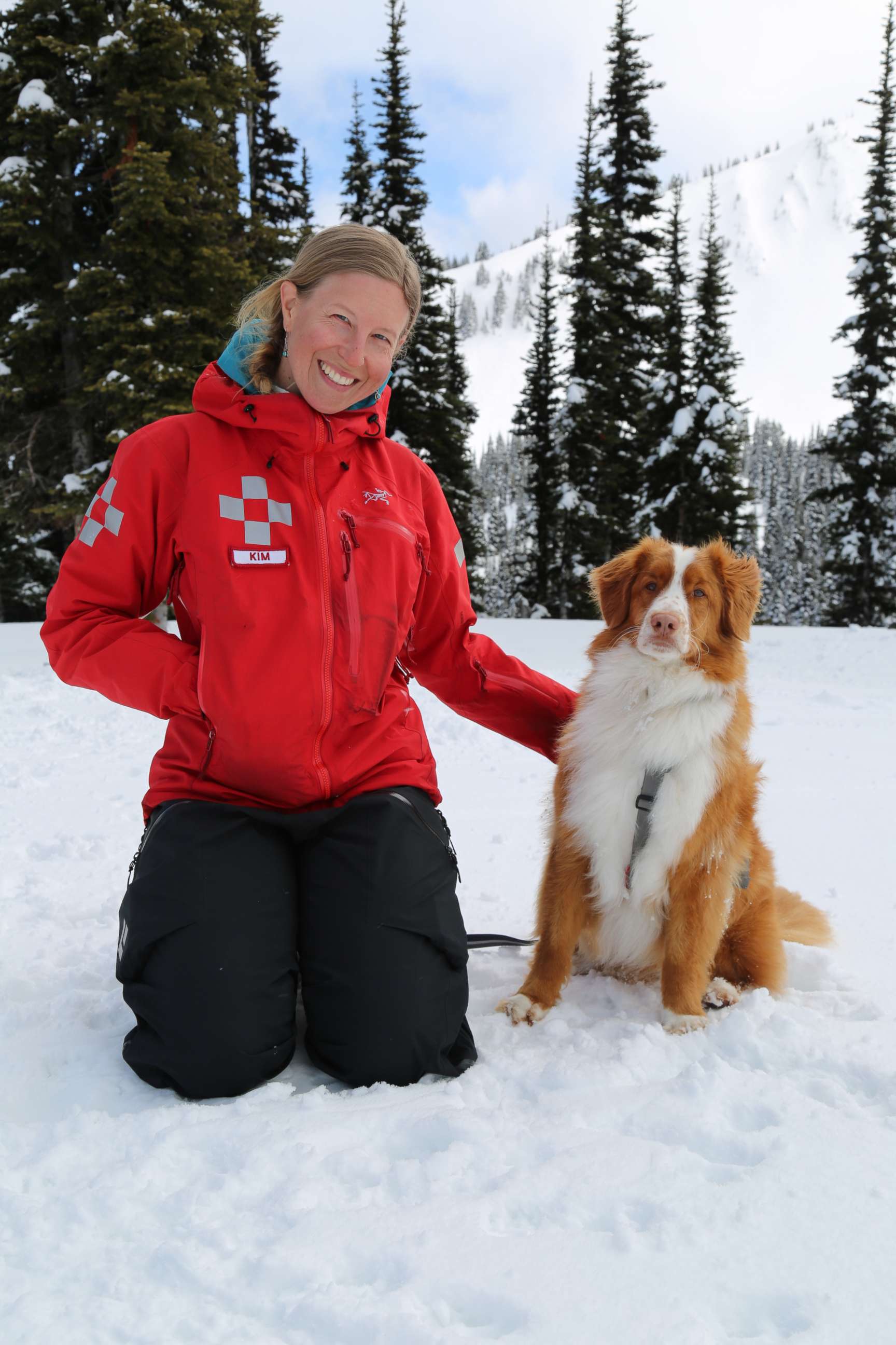 PHOTO: Ski Patroller Kim Haft pictured with Darwin atop Crystal Mountain.