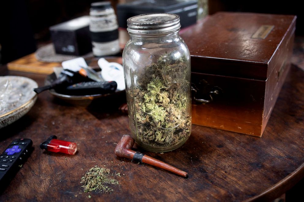 PHOTO: A jar of legally homegrown recreational use marijuana sits on a living room table, December 4, 2022 in Sullivan County, New York.