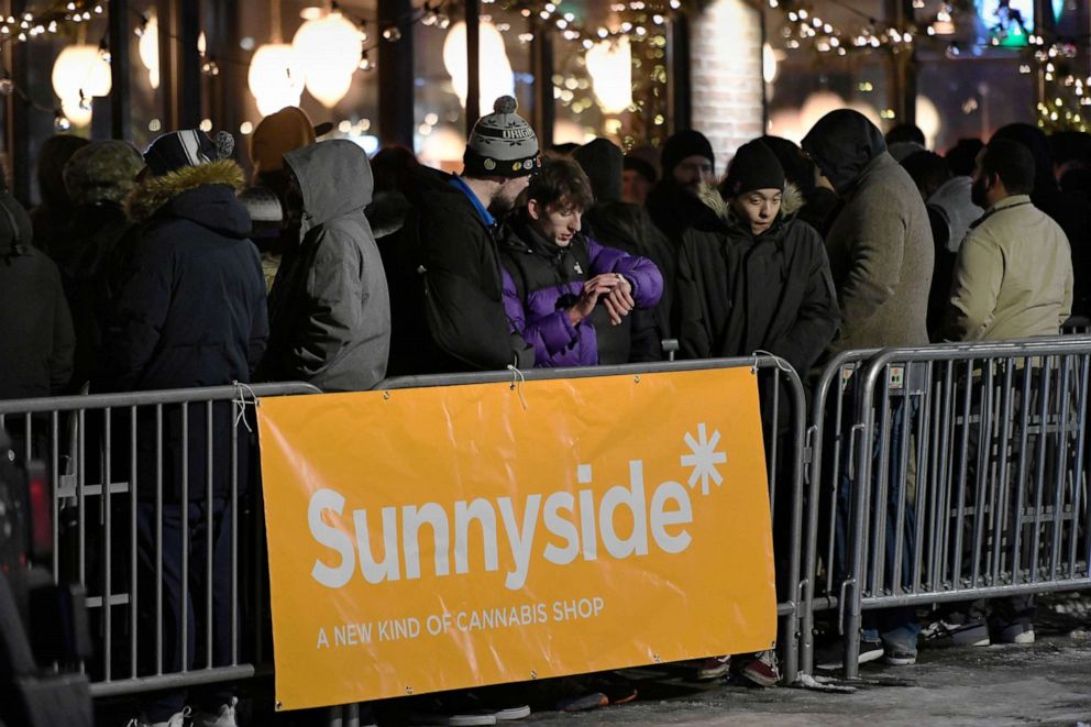 PHOTO: A long line of people brave the cold as they wait to be the first in Illinois to purchase recreational marijuana at Sunnyside dispensary, Jan. 1, 2020, in Chicago.