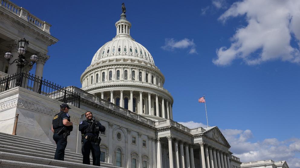 PHOTO: U.S. Capitol police officers chat on the steps of the Capitol in Washington, October 20, 2025.