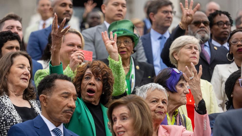 PHOTO: Democratic House members hold up four fingers, signifying the number of Republicans they need to vote with them, to stop Trumps Big Beautiful Bill, during a press conference on the steps of the Capitol in Washington, July 2, 2025.