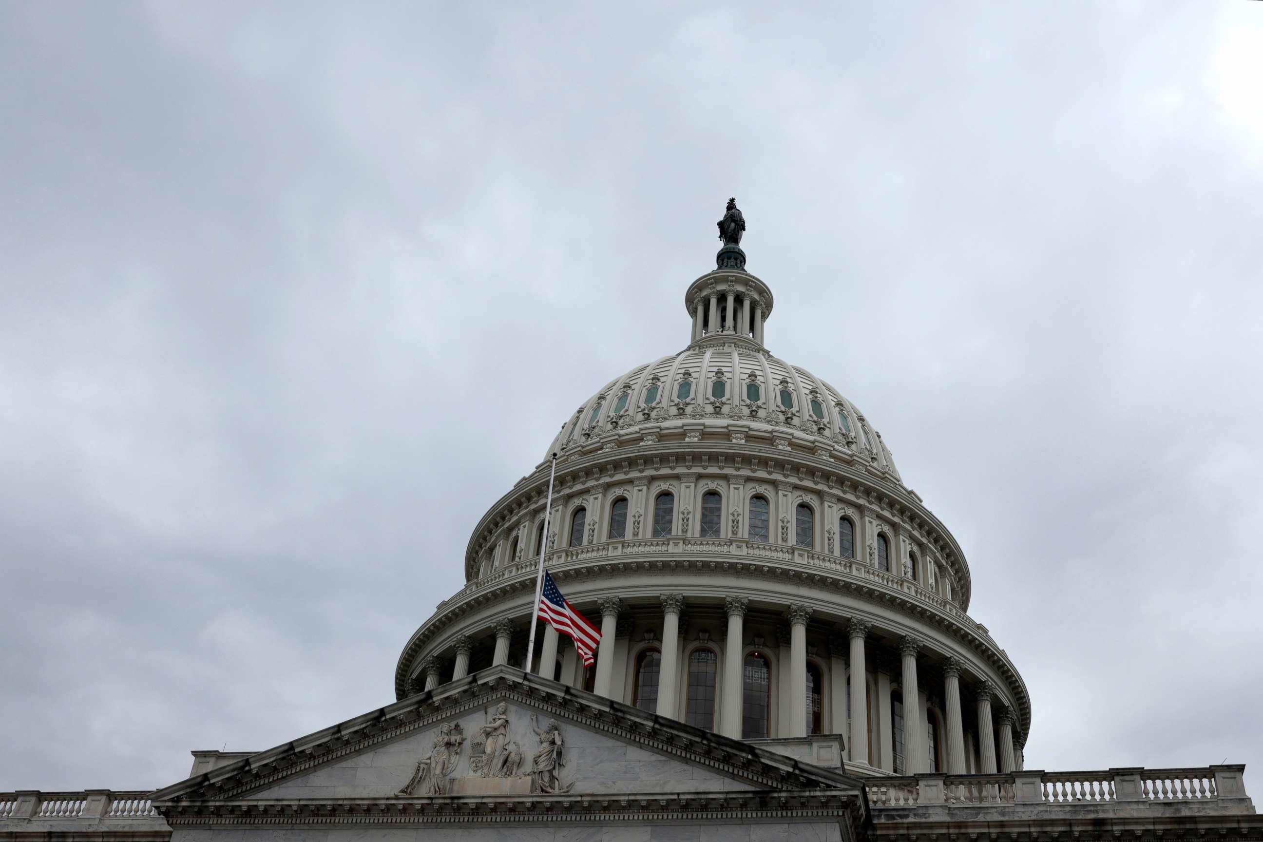 PHOTO: The U.S. flag is flown at half-staff over the Capitol Building in honor of former Senate Majority Leader Harry Reid, Dec. 29, 2021, in Washington, DC.