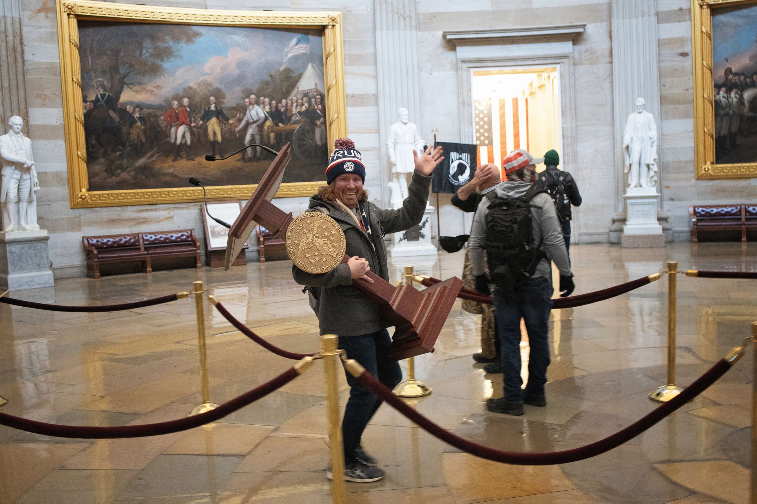 PHOTO: A pro-Trump rioter carries the lectern of Speaker of the House Nancy Pelosi through the Roturnda of the U.S. Capitol Building after a pro-Trump mob stormed the building, Jan. 6, 2021, in Washington, DC.