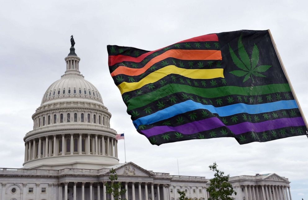 PHOTO: Activists wave flags during a rally to demand Congress to pass cannabis reform legislation on the East Lawn of the U.S. Capitol in Washington, D.C., Oct. 8, 2019.