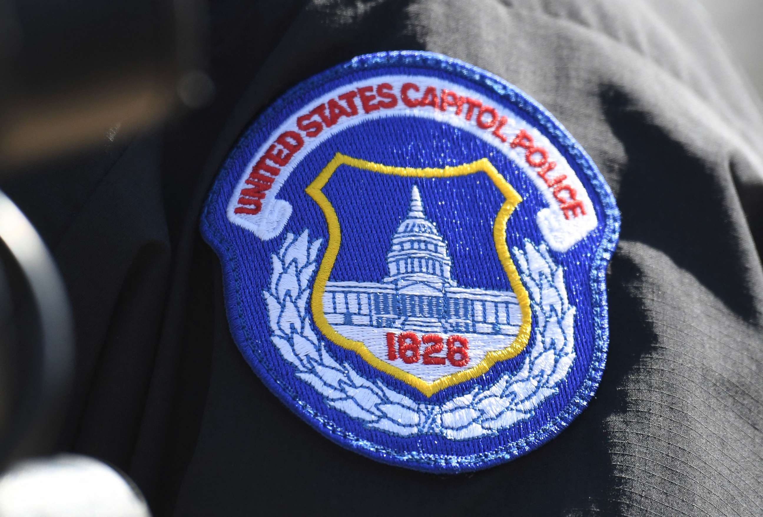 PHOTO: The badge of a Capitol Police Officer is seen during a press conference near the Capitol, April 2, 2021.