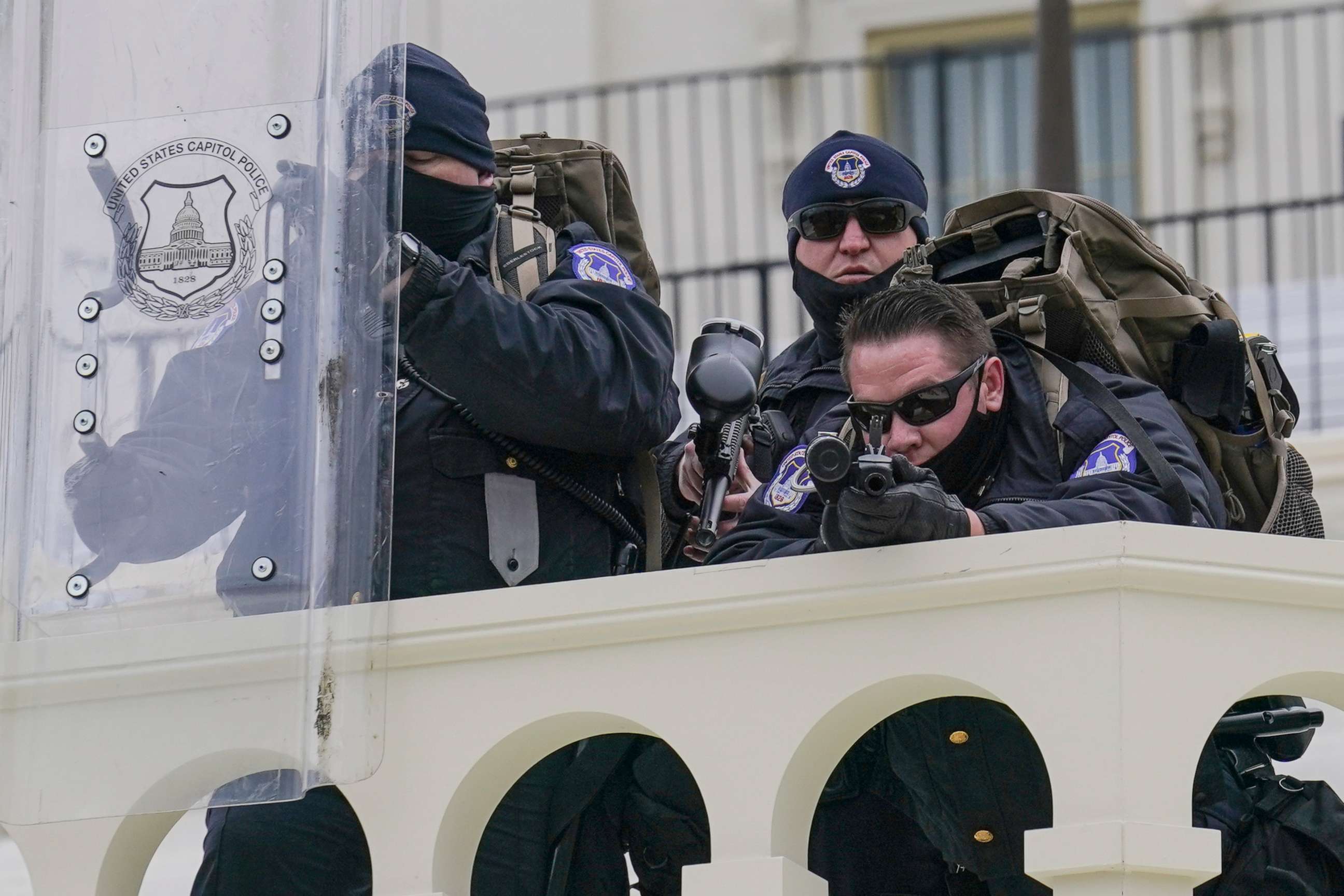 PHOTO: In this Jan. 6, 2021, file photo police keep a watch on rioters who tried to break through a police barrier at the Capitol in Washington. 