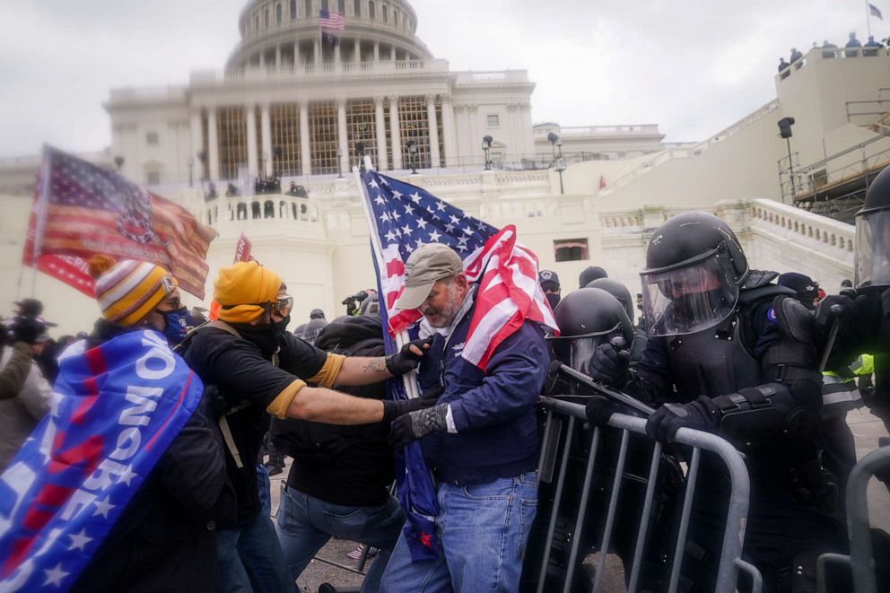 PHOTO: Rioters try to break through a police barrier at the Capitol in Washington on Jan. 6, 2021.