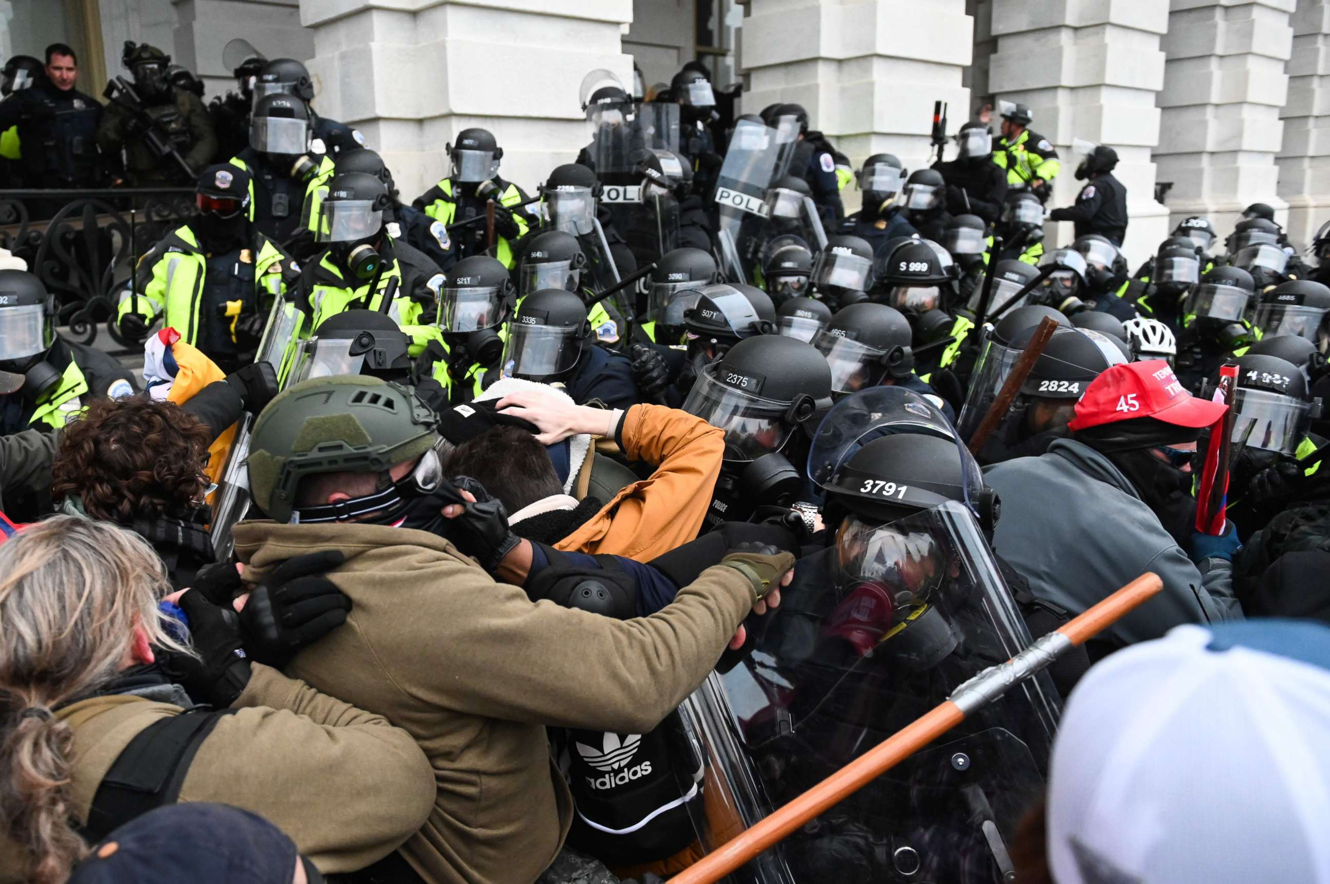 PHOTO: Riot police push back a crowd of supporters of US President Donald Trump after they stormed the Capitol building in Washington, D.C., Jan. 6, 2021.