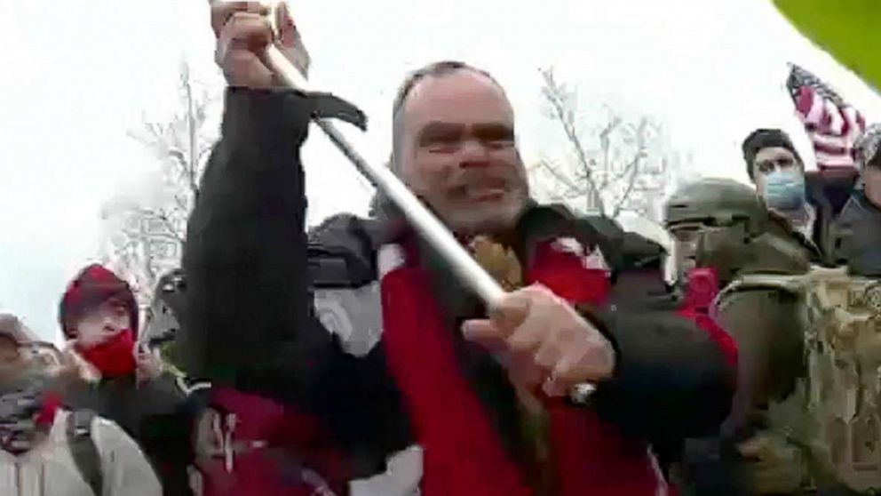 PHOTO: A still from Metropolitan Police Department body worn camera video shows Thomas Webster, in red jacket, at a barricade line at on the west front of the Capitol in Wasington, Jan. 6, 2021.