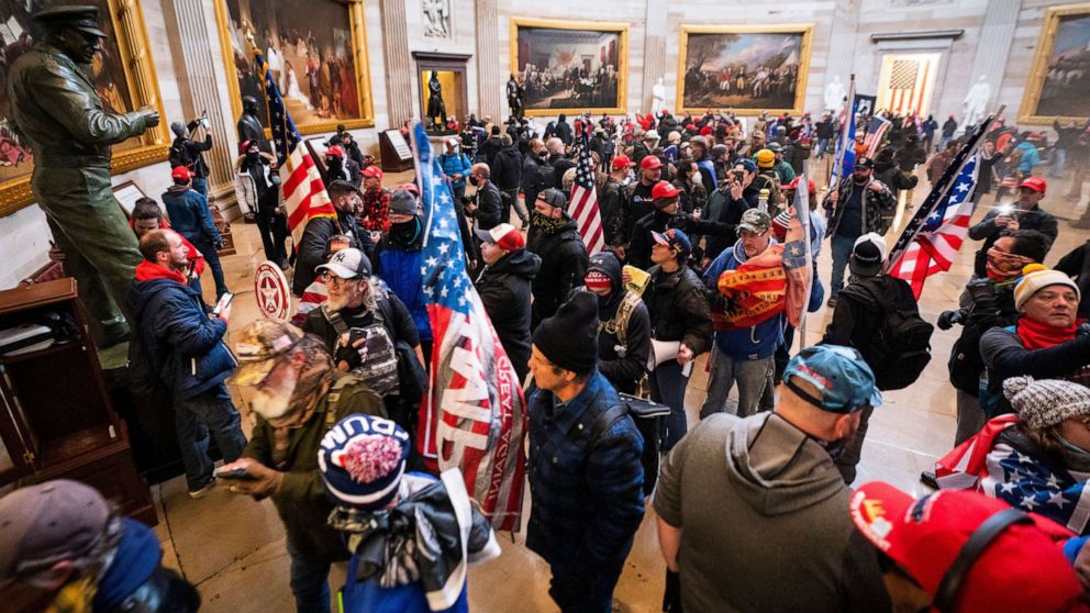 PHOTO: Supporters of President Donald Trump run through the Rotunda of the US Capitol after breaching Capitol security during their protest in Washington, on Jan. 6, 2020.