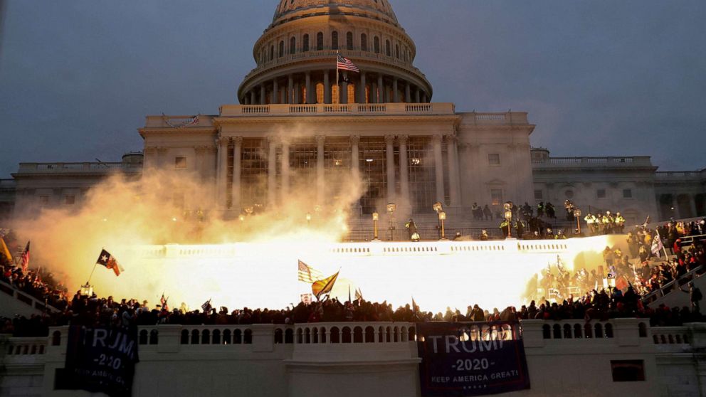 PHOTO: An explosion caused by a police munition is seen while supporters of U.S. President Donald Trump gather in front of the Capitol, Jan. 6, 2021.
