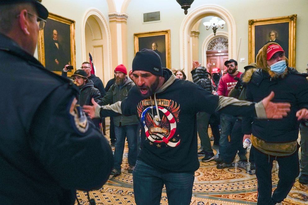 PHOTO: Supporters of U.S. President Donald Trump confront Capitol police officers in the hallway outside the Senate chamber at the U.S. Capitol in Washington, D.C., on Jan. 6, 2020.