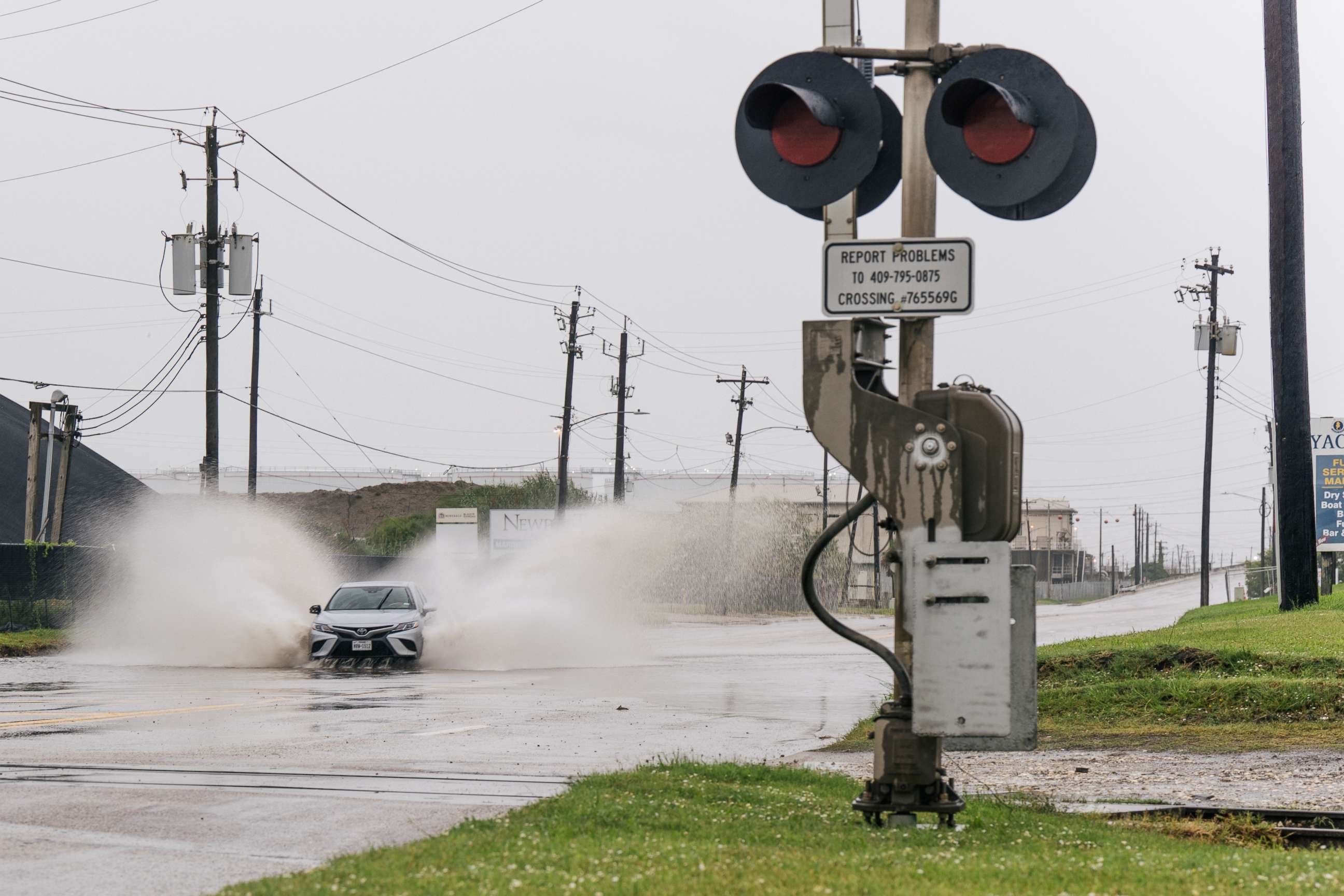 PHOTO: A car speeds through a flooded street ahead of the Tropical Storm Nicholas, Sept. 13, 2021 in Galveston, Texas.