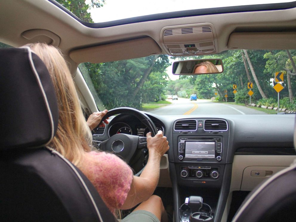 All New Cars In Us Now Required To Have Backup Cameras Abc News Photo A Woman Drives Car In An Undated Stock