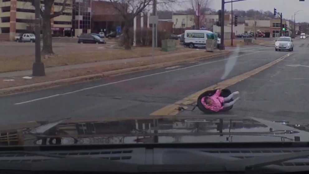 PHOTO: A child strapped to a car seat was saved after she fell out of a car onto the middle of a busy road in Mankato, Minn.
