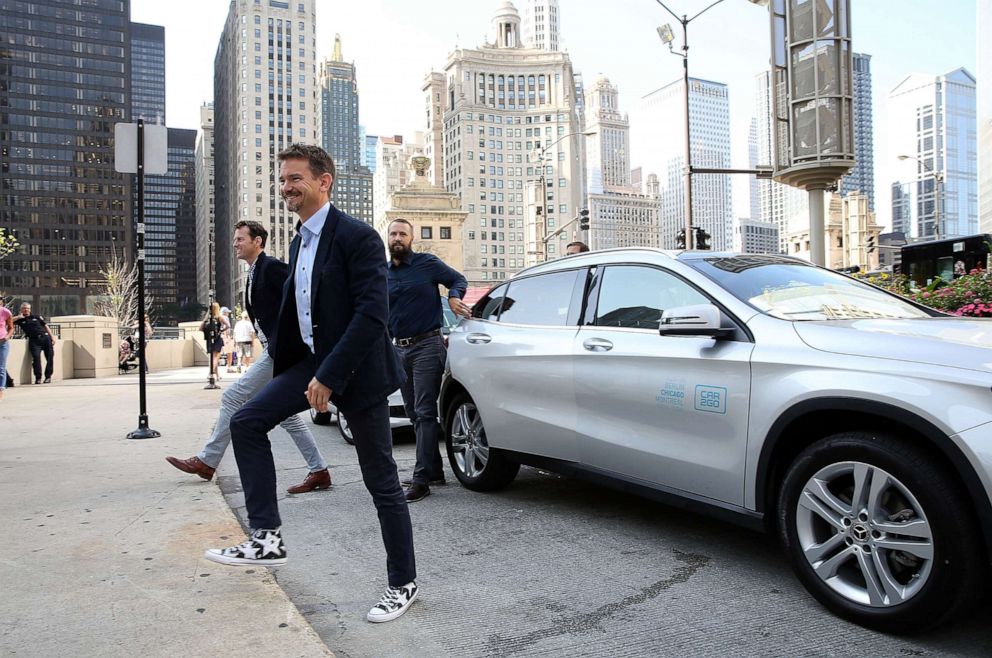 PHOTO: Mike Mikos, CFO car2go N.A., Olivier Reppert, Global CEO of car2go Group GmbH, and Paul DeLong, CEO of car2go N.A. arrive at the car2go launch event, July 25, 2018, in Chicago.