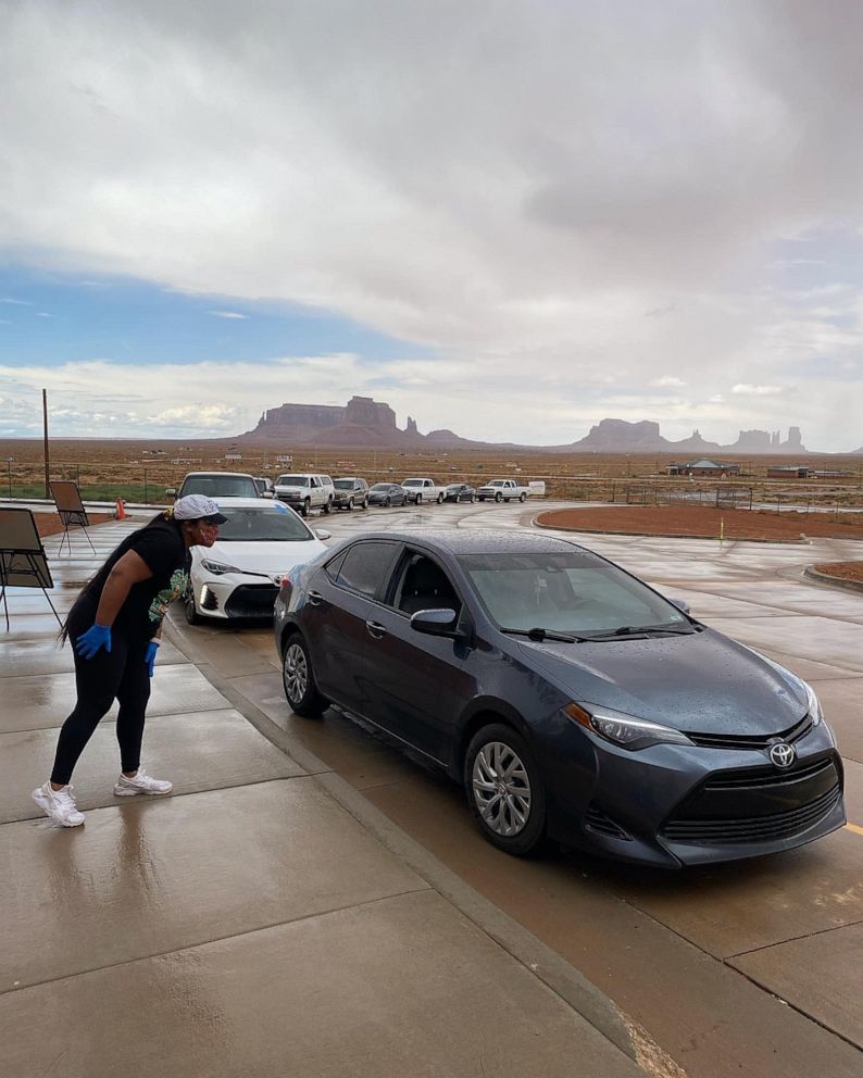 PHOTO: Shandiin Herrera, 23, working at a drive-thru event for Navajo & Hopi Families COVID Relief. 