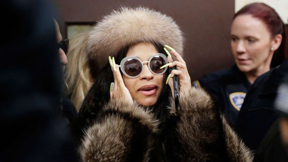 VIDEO: The 26-year-old rapper was decked out in all fur, replete with a fur hat, as she strutted up the steps of Queens Criminal Court.