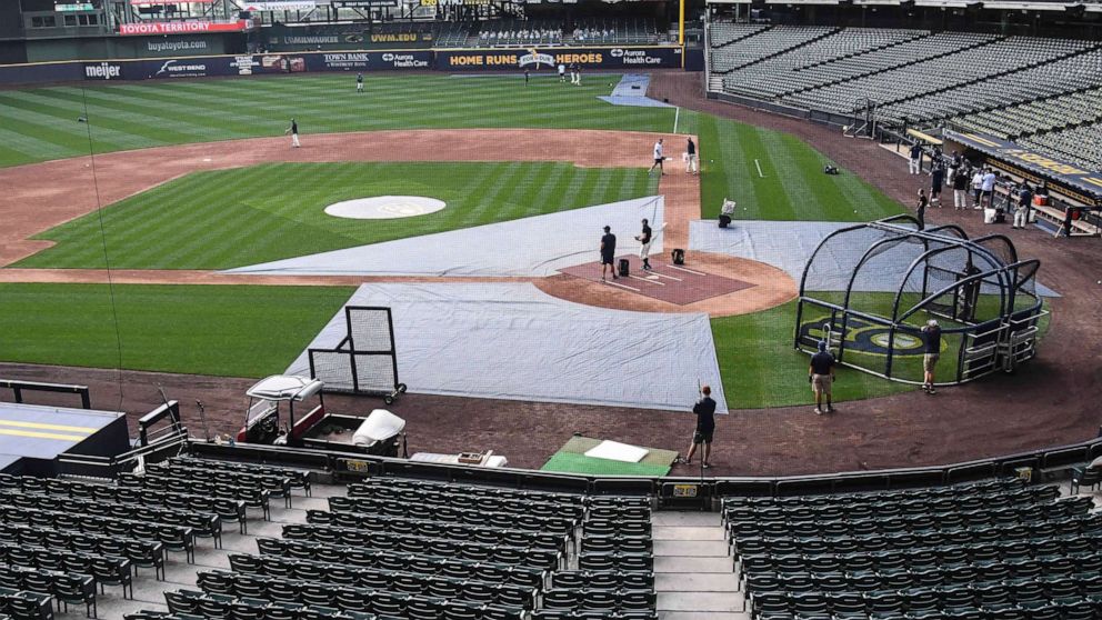 PHOTO: The Milwaukee Brewers took batting practice after their game against the St. Louis Cardinals was cancelled due to the pandemic at Miller Park, July 31, 2020, in Milwaukee.