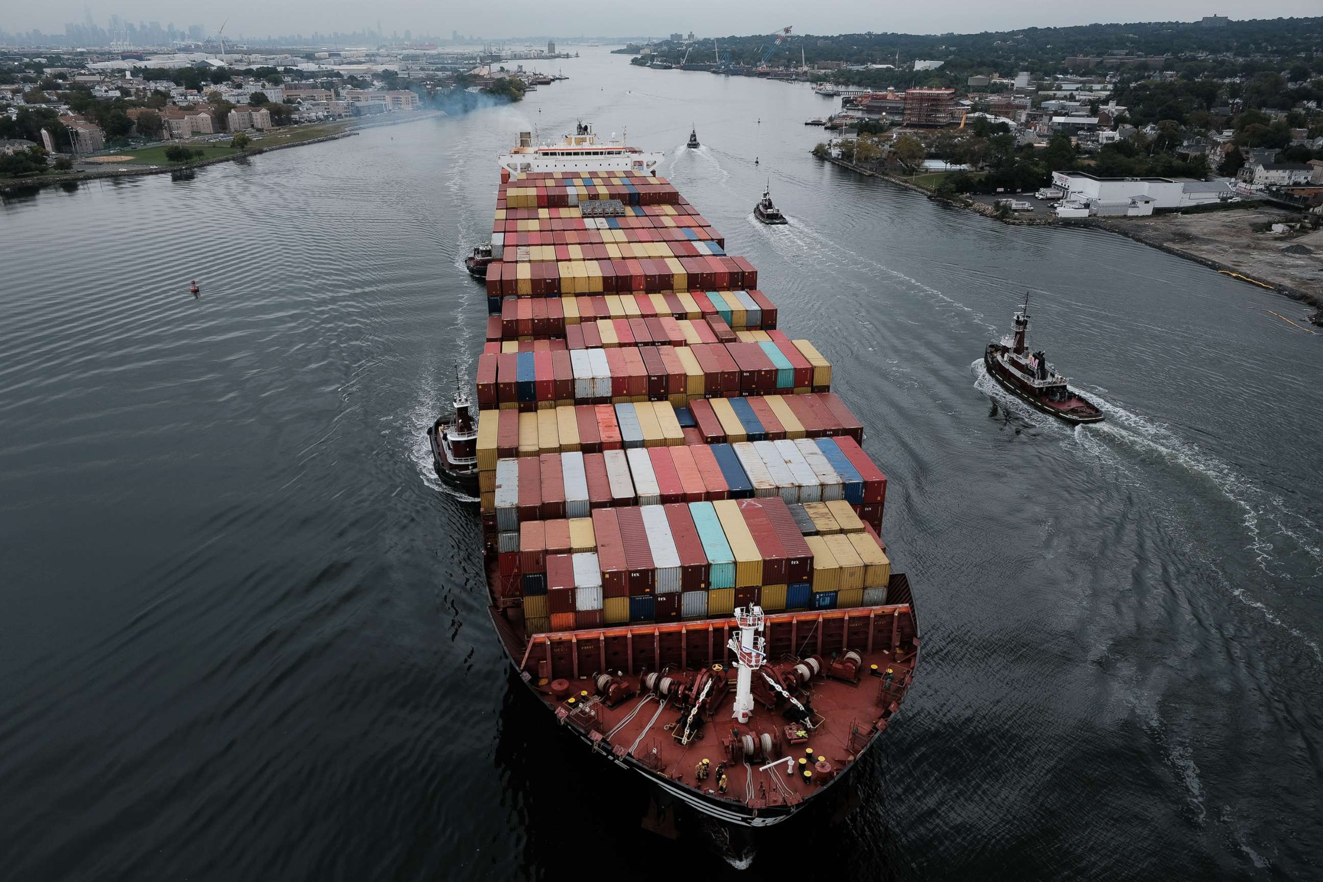 PHOTO: A cargo ship moves under the Bayonne Bridge as it heads into port, Oct. 13, 2021, in Bayonne, N.J. 