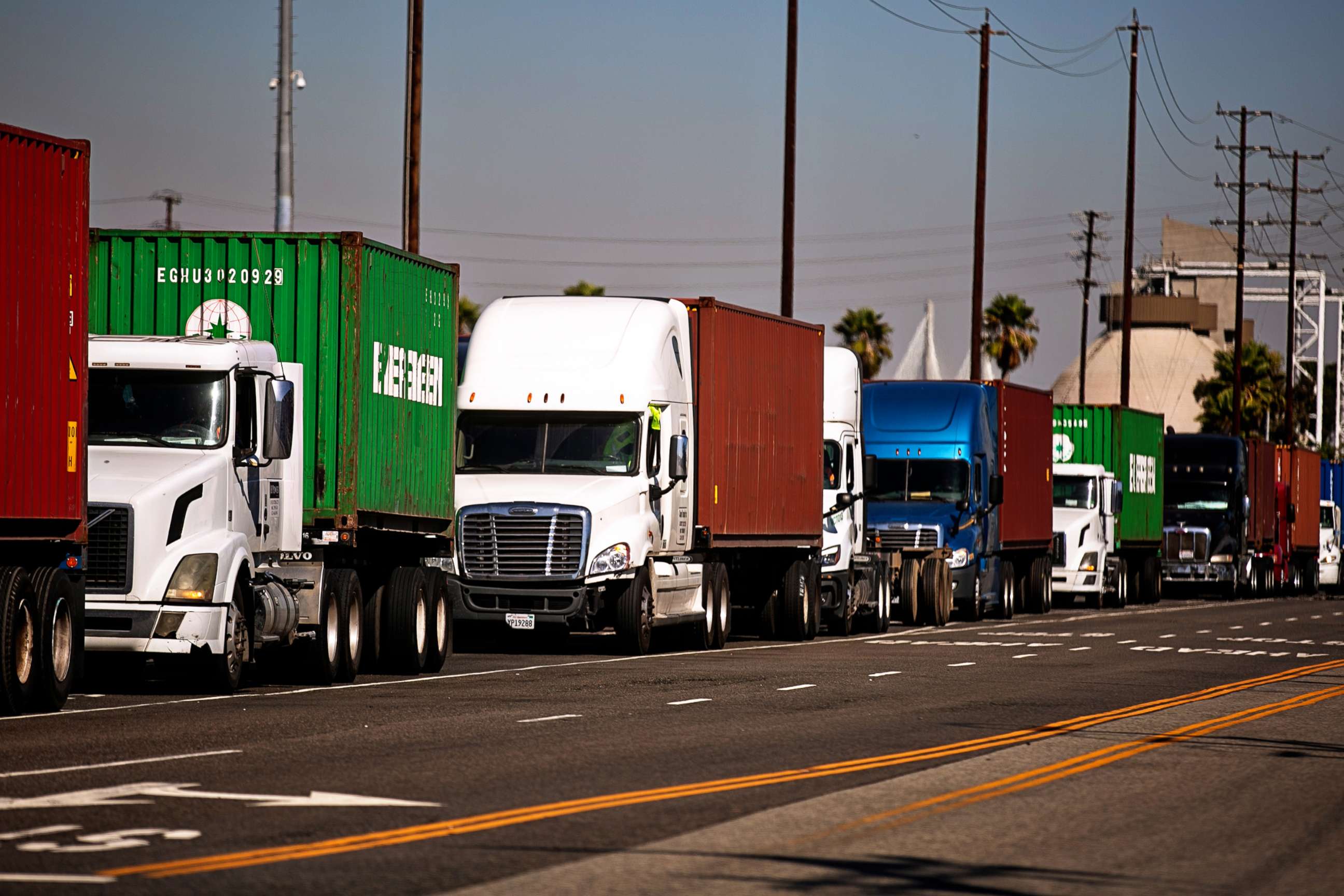 PHOTO: As far as the eye can see cargo trucks wait in long lines to enter The Port of Los Angeles as the port is set to begin operating around the clock, Oct. 13, 2021, in San Pedro, Calif.