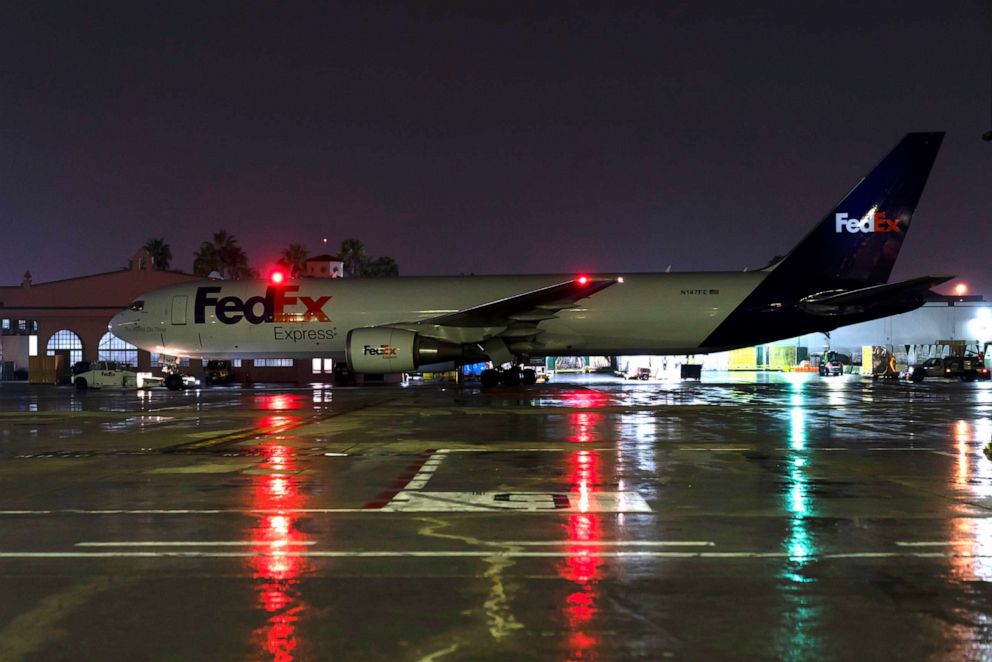 PHOTO: In this Dec. 7, 2021, file photo, a FedEx cargo plane taxis on the tarmac at the FedEx regional hub at the Los Angeles International Airport in Los Angeles.
