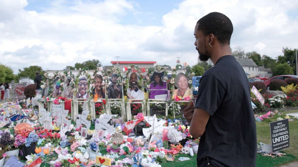 Photo: Carlton Steverson visits a memorial in front of the East Buffalo Tops Market where 10 black people were killed in a racially motivated mass shooting on May 14, 2022.
