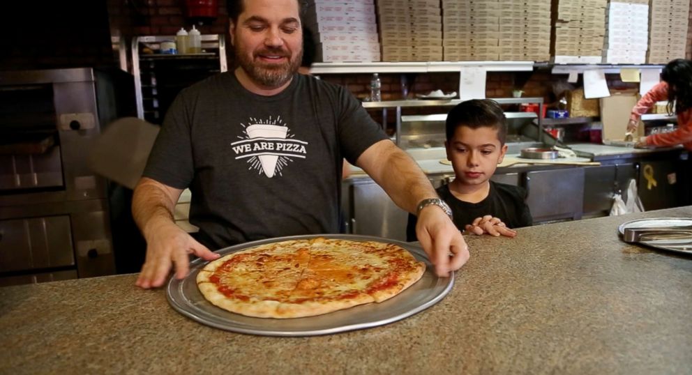 PHOTO: Carmine Testa and his son Nicholas are photographed here at Carmine's Pizza Factory in Jersey City, New Jersey.