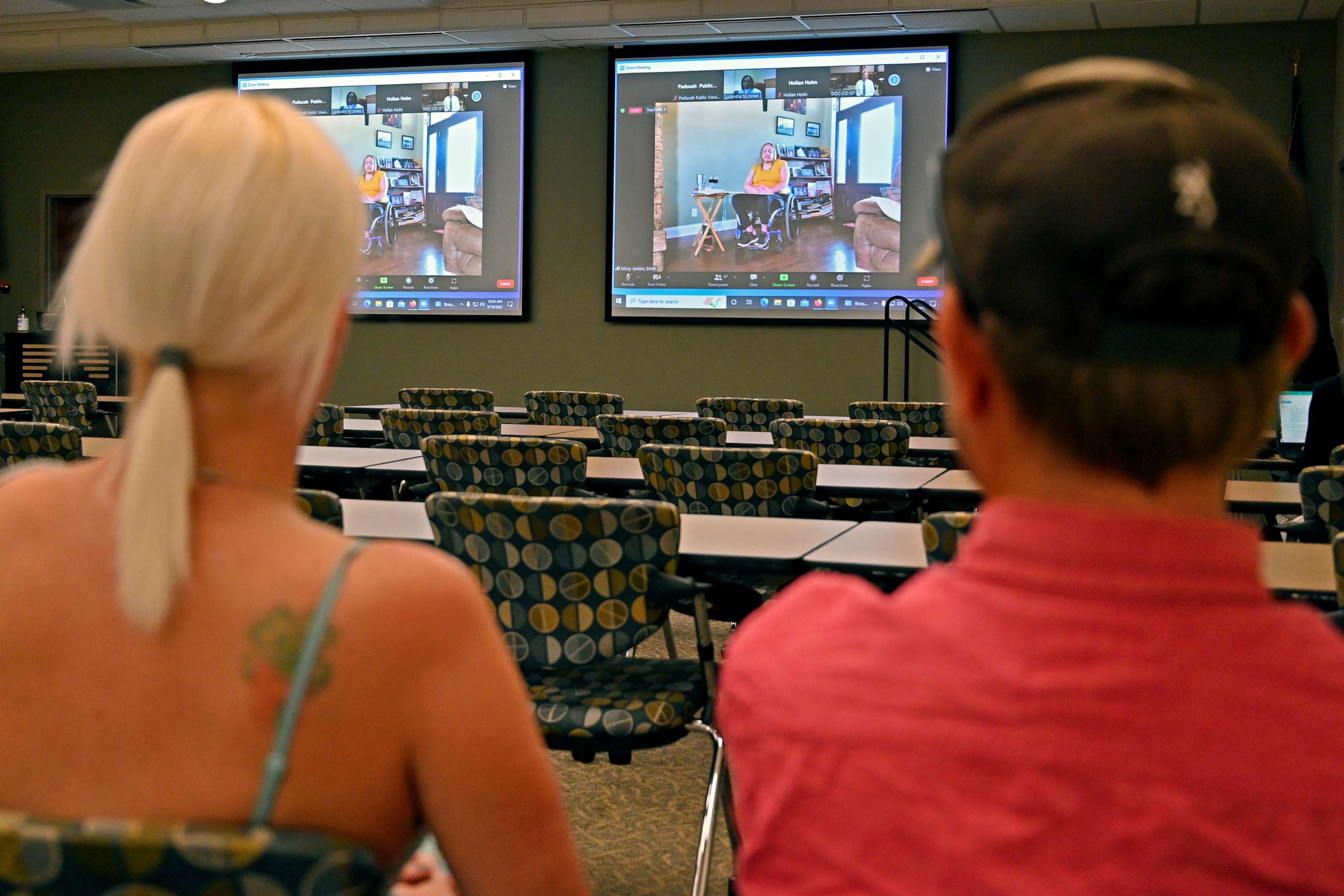 PHOTO: Members of the public watch testimony during the zoom broadcast of the Michael Carneal parole hearing at the West Kentucky Community and Technical College in Paducah, Ky., Sept. 19, 2022.